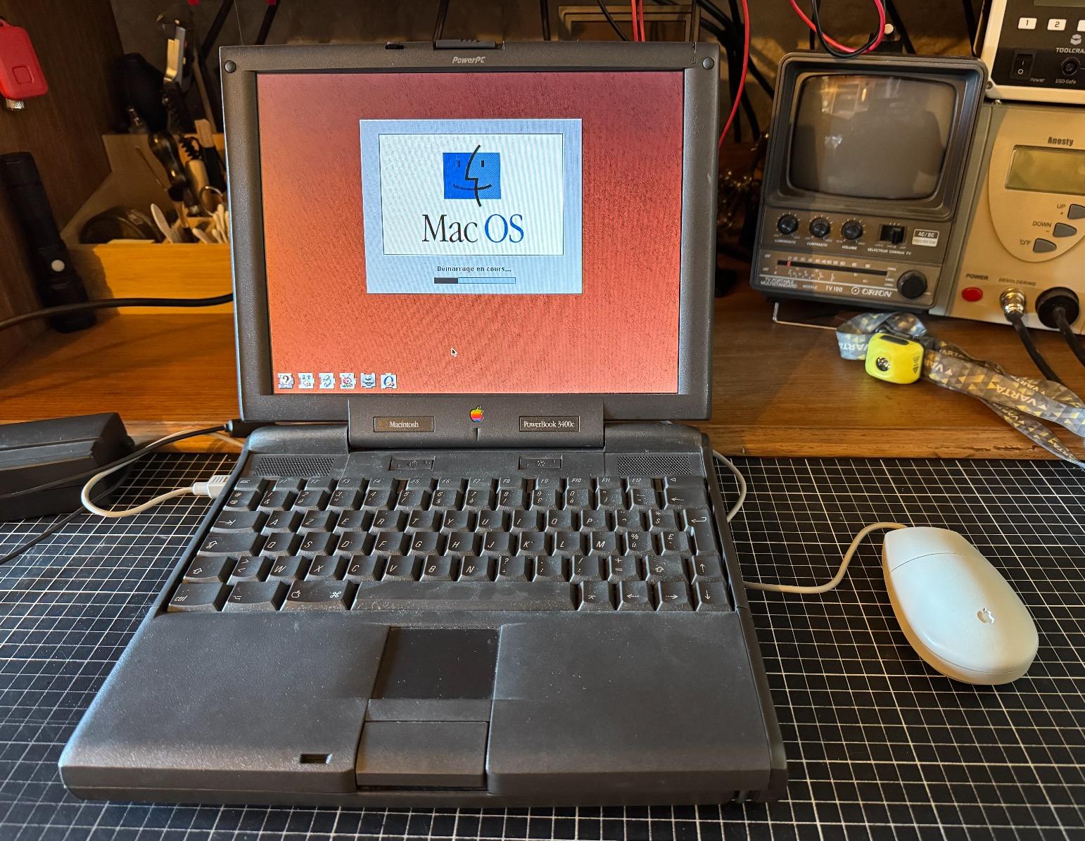 Vintage Apple laptop starting up