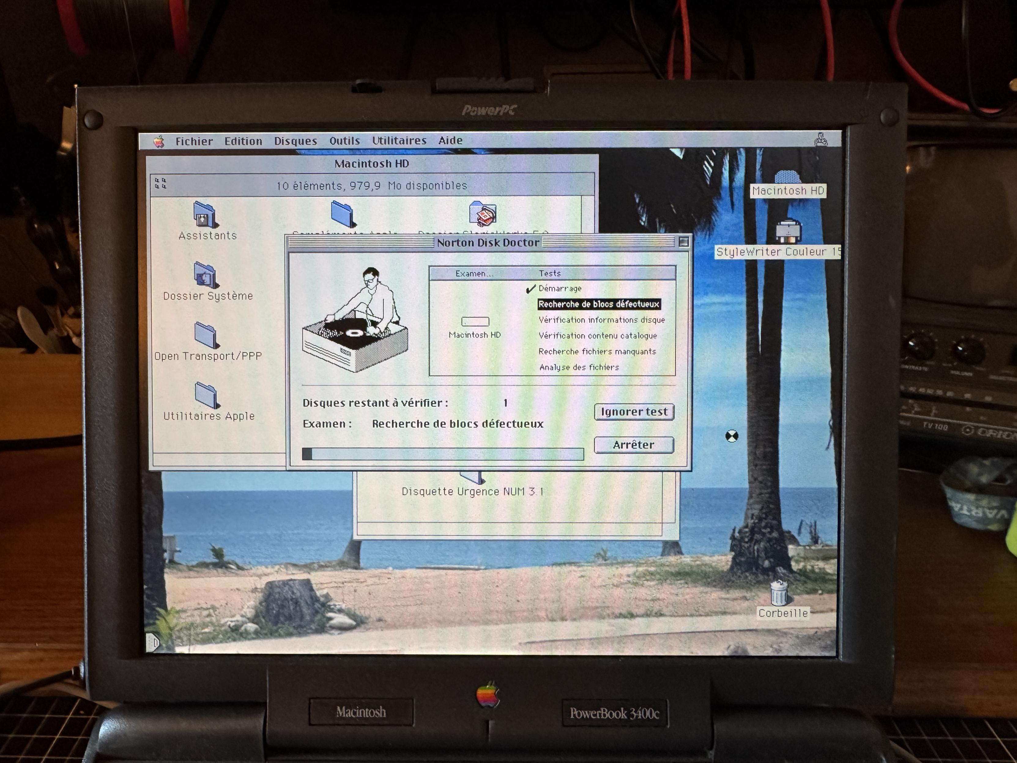 Vintage Apple laptop performing hard drive test